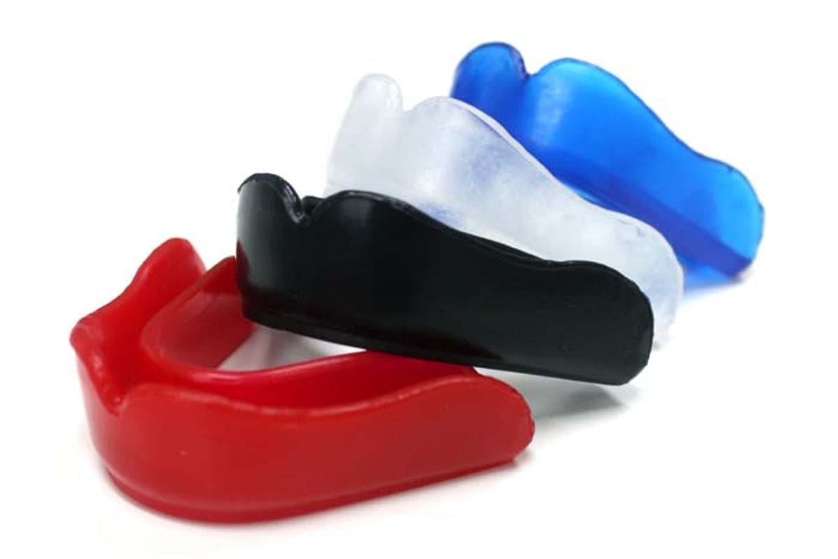 Colorful mouth guards displayed on a table at Unique Dental of Framingham.